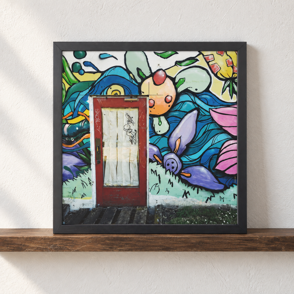 Mexico Street Art photograph in a black frame resting on a wood picture ledge; styled mockup.